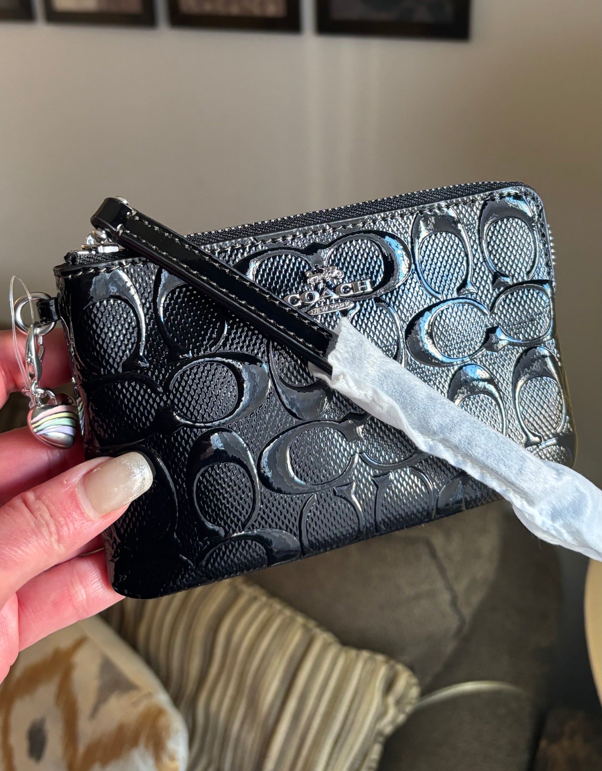 Authentic COACH patent signature leather zip top wristlet with a heart charm 
New with tags - Ruby Luxury