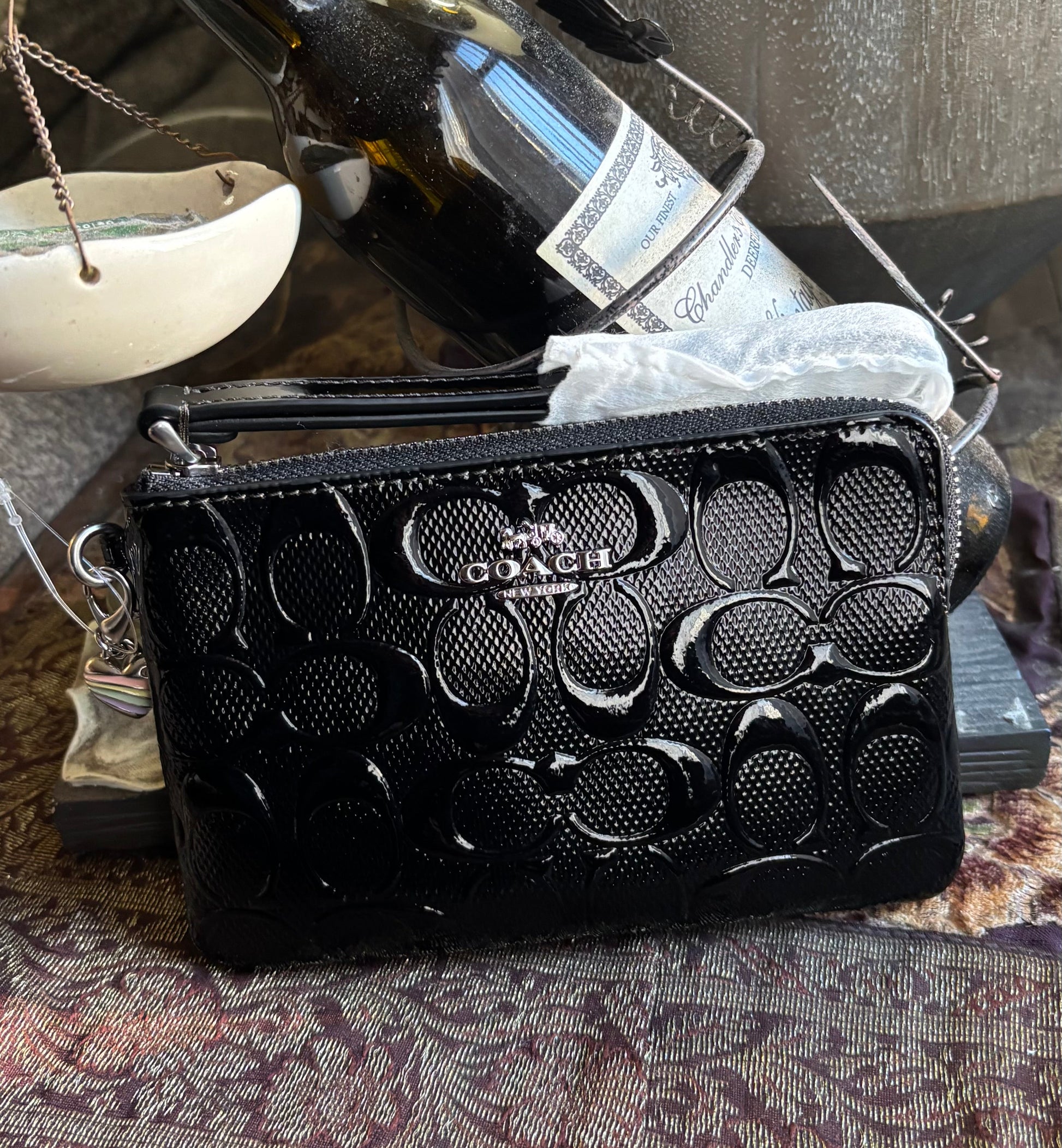 Authentic COACH patent signature leather zip top wristlet with a heart charm 
New with tags - Ruby Luxury