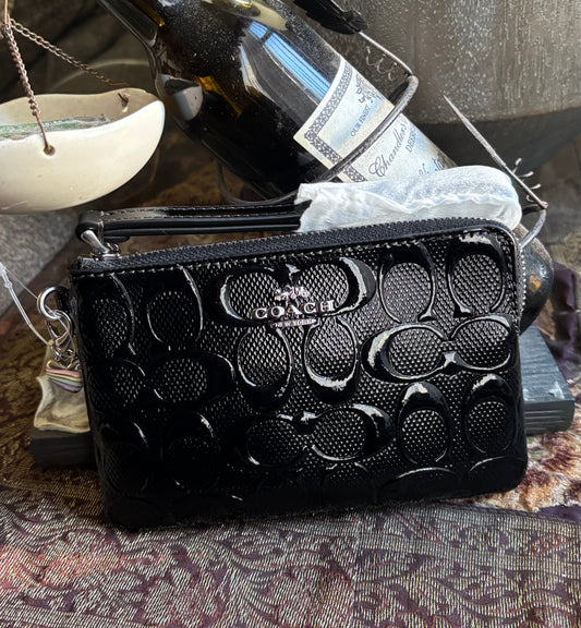 Authentic COACH patent signature leather zip top wristlet with a heart charm 
New with tags - Ruby Luxury