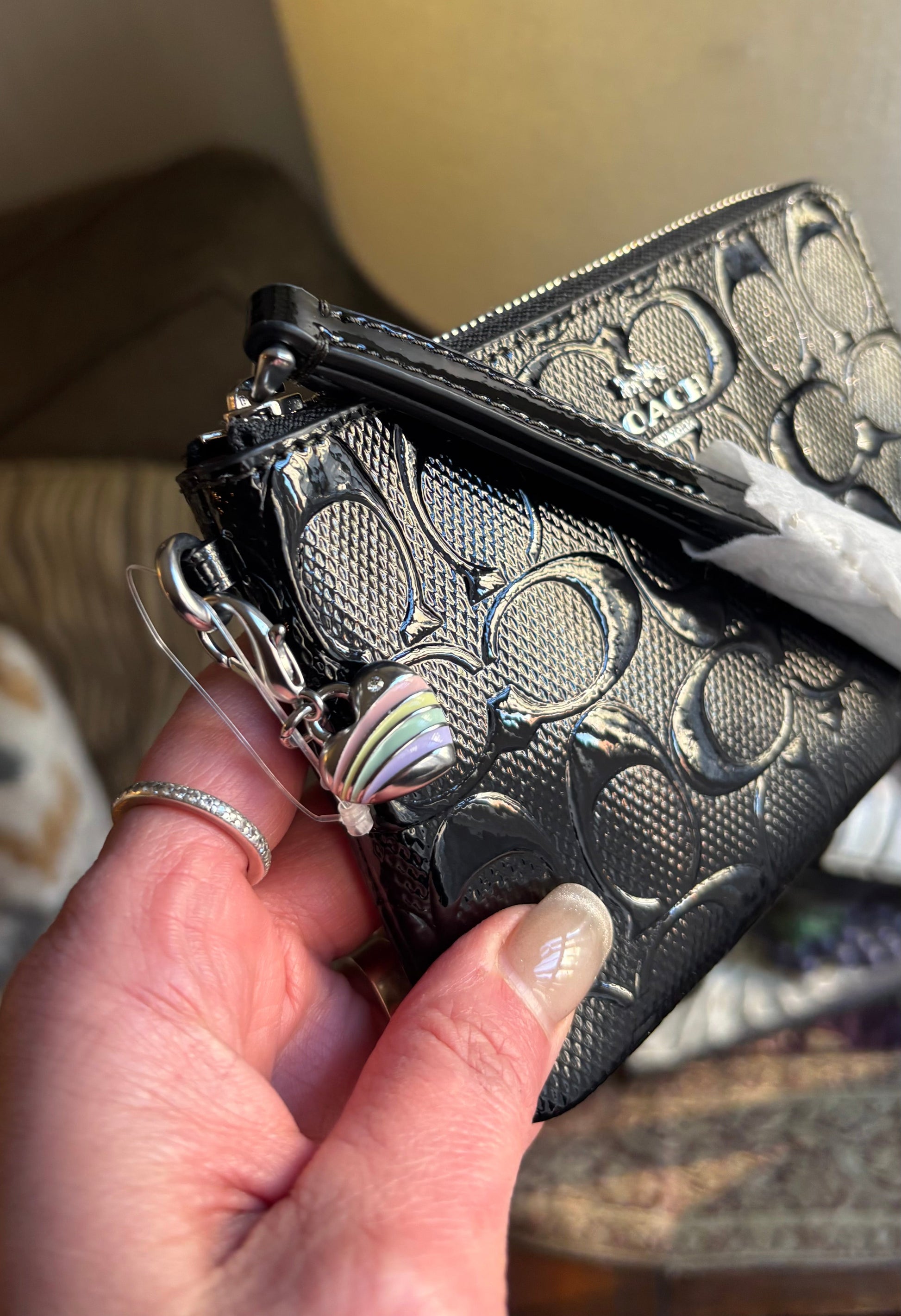 Authentic COACH patent signature leather zip top wristlet with a heart charm 
New with tags - Ruby Luxury