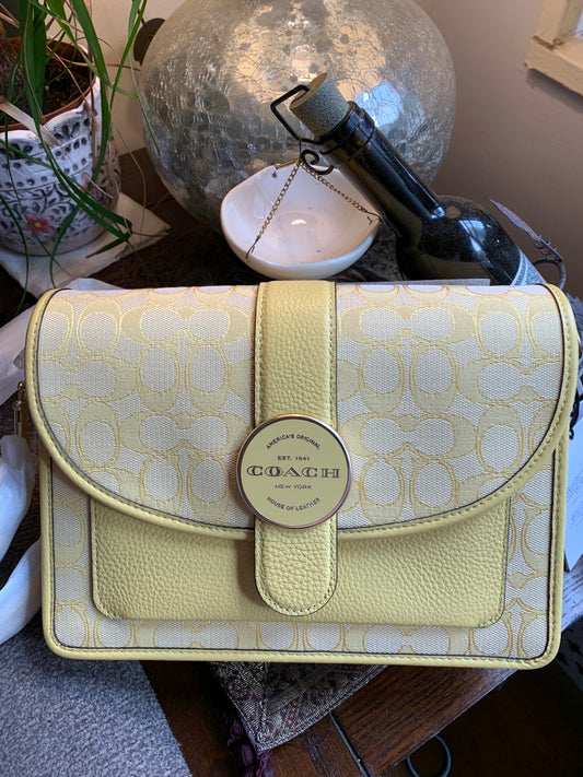 Authentic COACH Leather /signature jacquard canvas flap Crossbody
New with tags Ruby Luxury