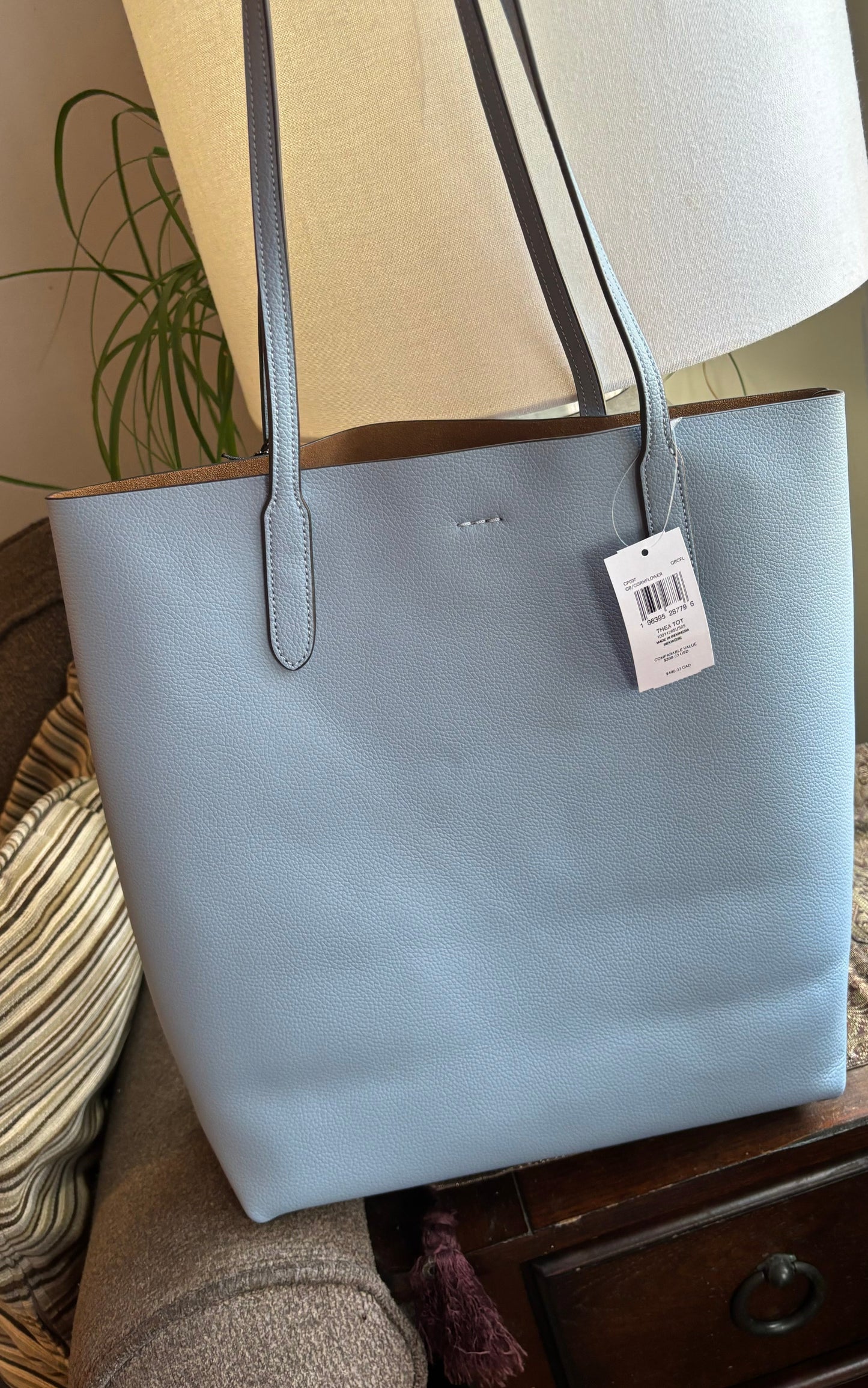 Authentic COACH Pebbled leather/suede snap long Tote
New with tags Ruby Luxury