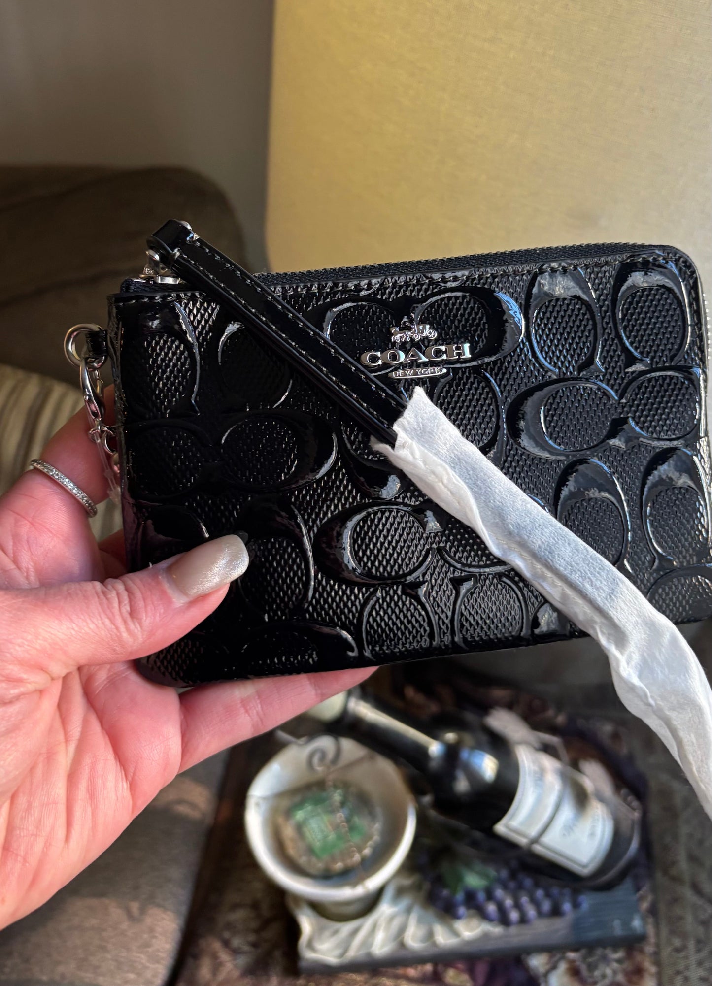 Authentic COACH patent signature leather zip top wristlet with a heart charm 
New with tags - Ruby Luxury