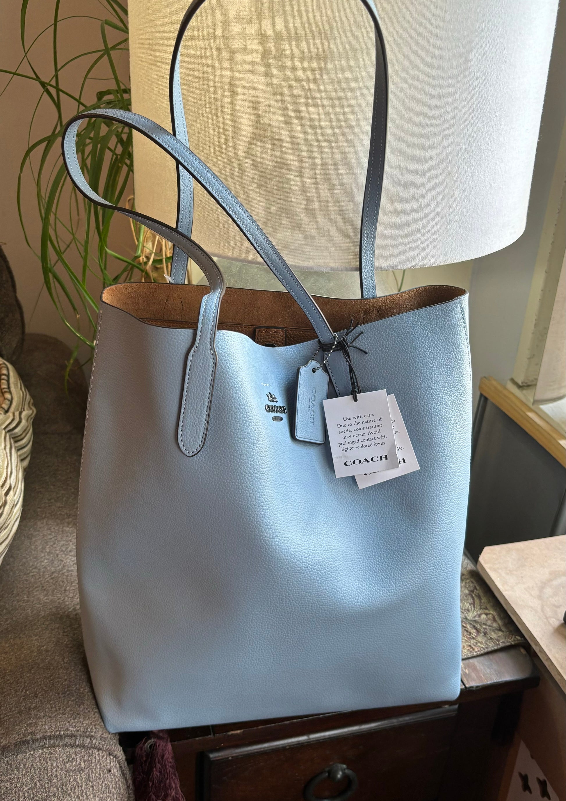 Authentic COACH Pebbled leather/suede snap long Tote
New with tags Ruby Luxury