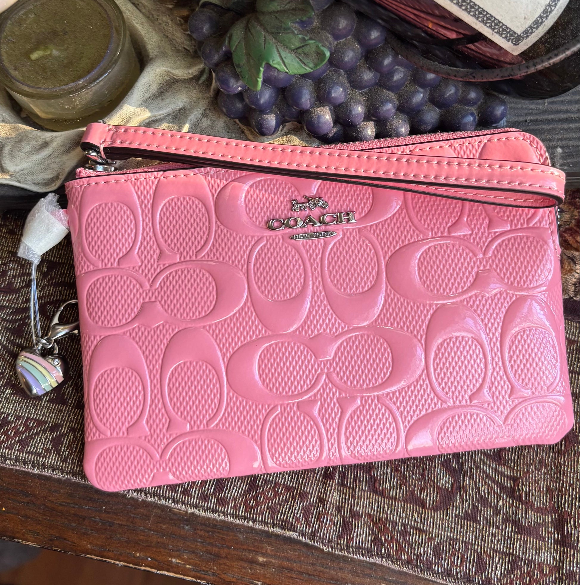 Authentic COACH patent signature leather zip top wristlet with a heart charm  New with tags - Ruby Luxury